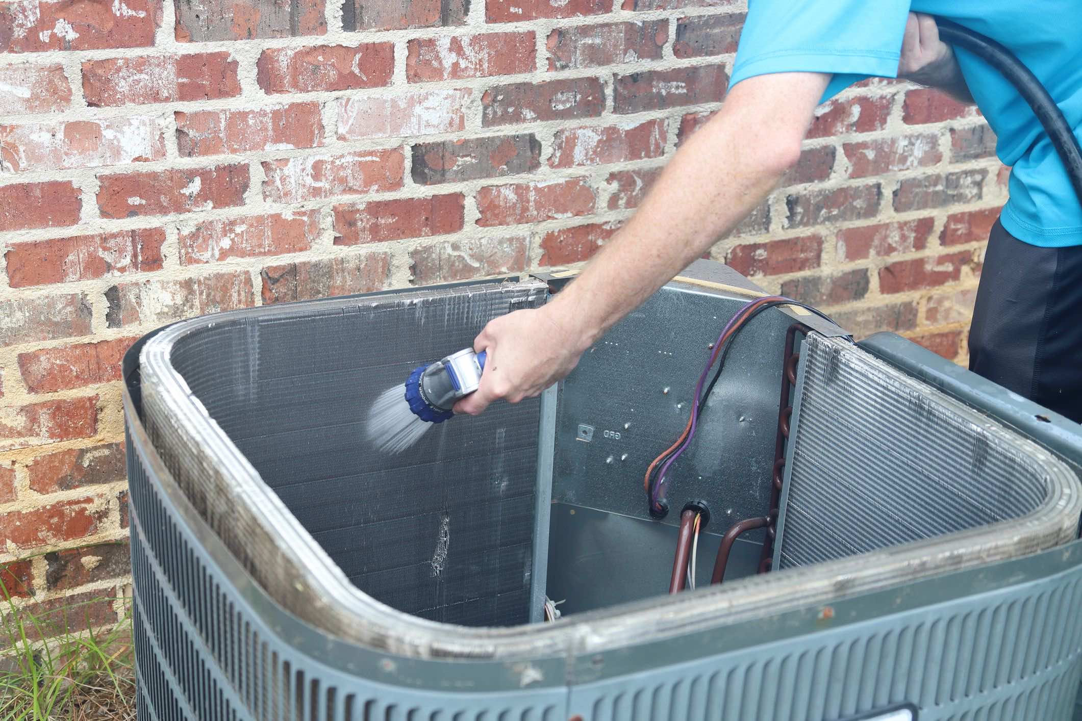 STAT Technician Repairing an outdoor AC unit
